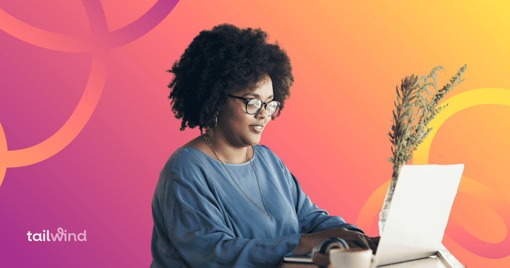 Woman working on her laptop on a magenta and orange background with the word Tailwind in white font. 