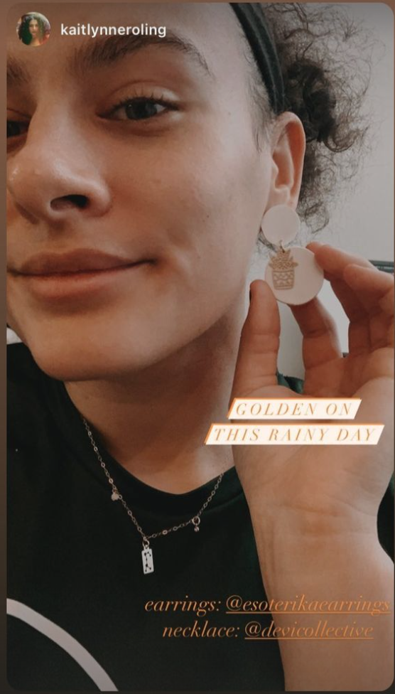 Screenshot of an instagram story showing a woman wearing earrings and a necklace with the tags of the accounts of the jewelry businesses she bought them from.